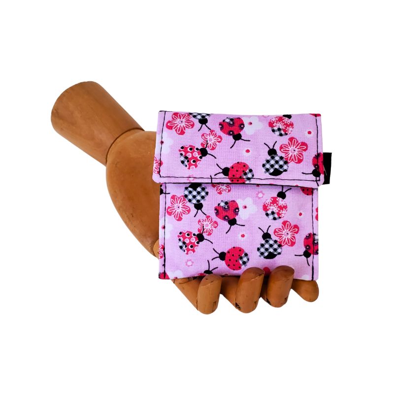 Ladybug print on a pink background. Velcro Mini Wallet by Anne Marie Beard. Handmade in Austin, Texas since 2004 y'all! annemarie mini wallet austin texas ladybug creatures cute picnic spring