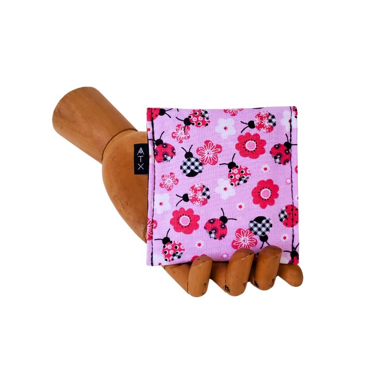 Ladybug print on a pink background. Velcro Mini Wallet by Anne Marie Beard. Handmade in Austin, Texas since 2004 y'all! annemarie mini wallet austin texas ladybug creatures cute picnic spring