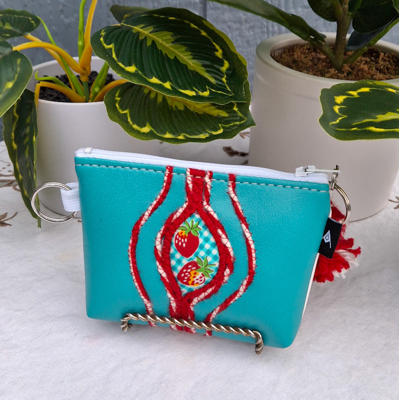 Sacred Fruit Teal Embroidered Vagina Vulva Wallet with Strawberry Sweet Spot. Made by Anne Marie Beard. Handmade in Austin, Texas since 2002 y'all! annemarie yoni feminist divine feminine strawberry shortcake