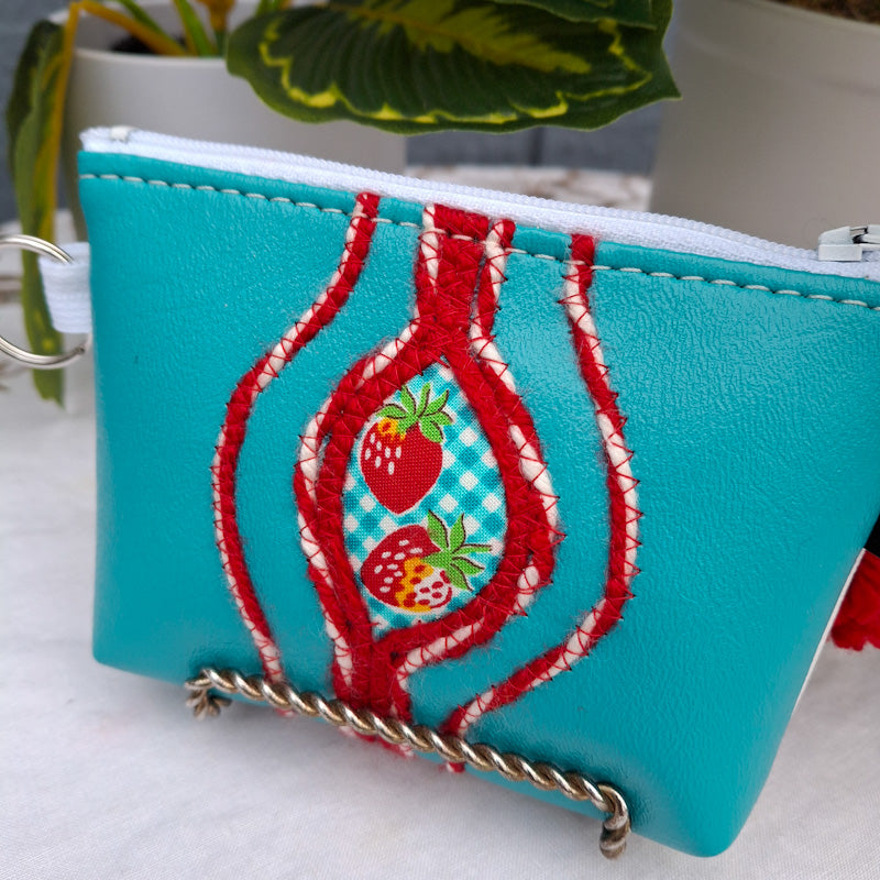 Sacred Fruit Teal Embroidered Vagina Vulva Wallet with Strawberry Sweet Spot. Made by Anne Marie Beard. Handmade in Austin, Texas since 2002 y'all! annemarie yoni feminist divine feminine strawberry shortcake